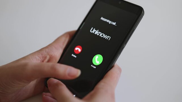 Smartphone screen displaying incoming call from unknown caller.