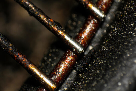 Abstract Macro Texture of Burnt and Greasy Metal Grid with Light Reflections