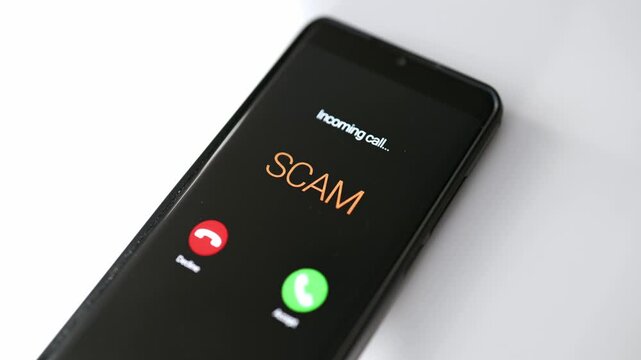 Close-up of smartphone screen displaying dangerous incoming scam call.