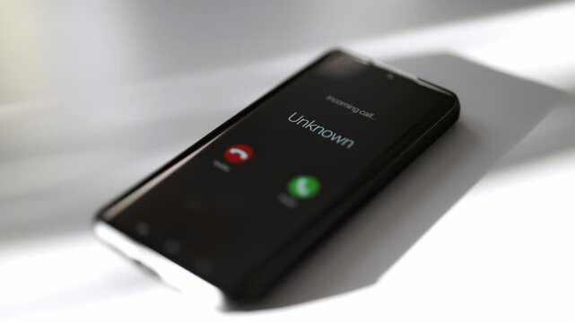 Smartphone screen displaying incoming call from unknown caller.