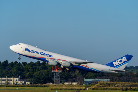 A Nippon Cargo Airlines (NCA) Boeing 747-8F freighter taking off and climbing at Narita International Airport on November 4, 2024 in Narita, Japan.