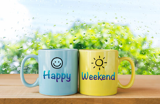 Happy weekend on coffee mug over blurred glass window background