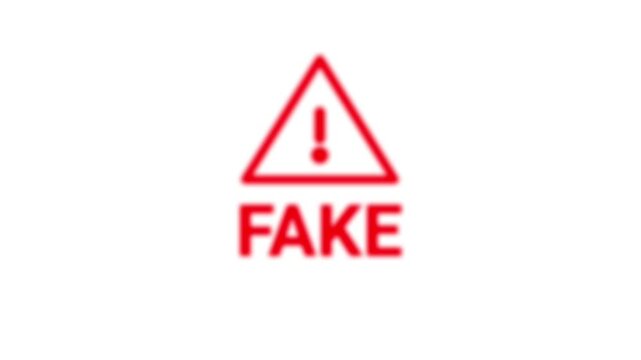 Blurred red "FAKE" word sign seal stamp. Green screen, chromakey