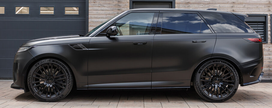 Ljubljana, Slovenia - 18 May 2026: This black Range Rover SV showcases its luxury design and premium craftsmanship in a modern location during daylight.