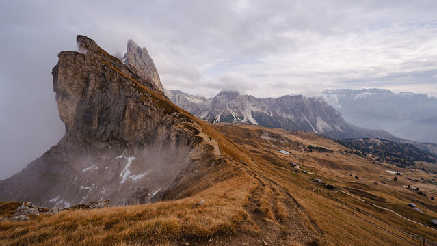 Scenic landscape view of the Dolomites Alps featuring the Odle mountain range and Seceda peak in Italy. Captures dramatic alpine scenery,