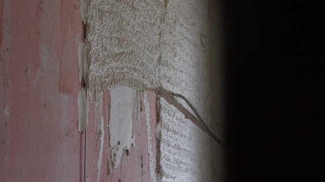 Fresh cement plaster texture on interior wall after machine application
