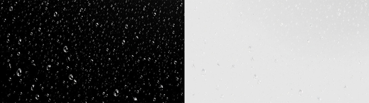 Rain droplets fall against a transparent background creating a scattered pattern that resembles a soft texture