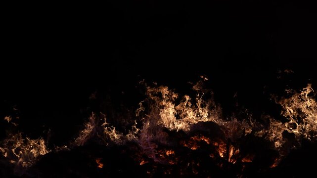 Fire embers particles over black background. Fire sparks background. Abstract dark glitter fire particles lights. 4K Video.
