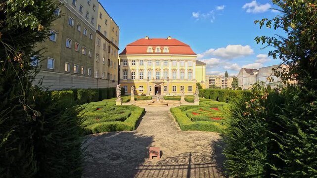 Timelapse of clouds moving over royal baroque palace and garden.