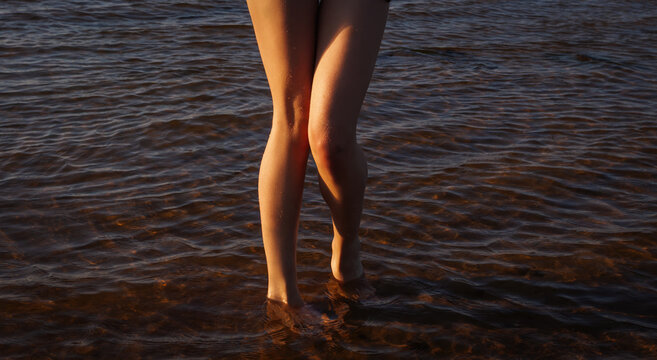 Naked woman enjoying nature on the beach