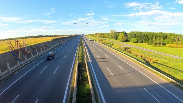 Timelapse of cars driving fast on a multi lane highway.