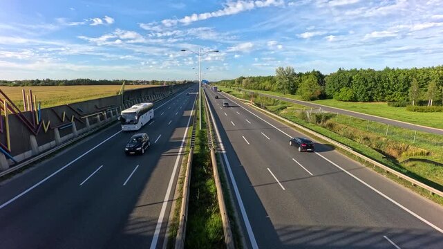 Timelapse of cars driving fast on a multi lane highway.
