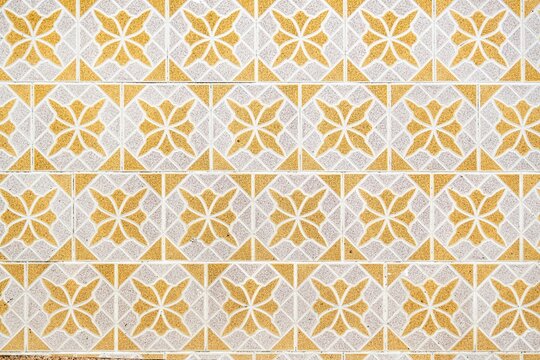 Yellow and white patterned colonial ceramic tiles texture