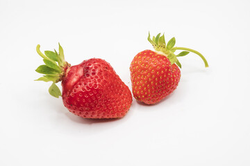 Ripe red strawberries isolated on white background with fresh organic berries and detailed natural texture close up © Olha