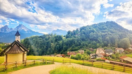 Fototapeta premium Charming Alpine Chapel with Scenic Village View in Berchtesgaden, Bavarian Alps, Germany