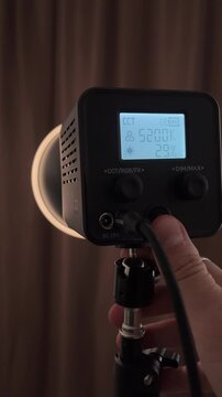 Turning on professional LED video light - power button and LCD display