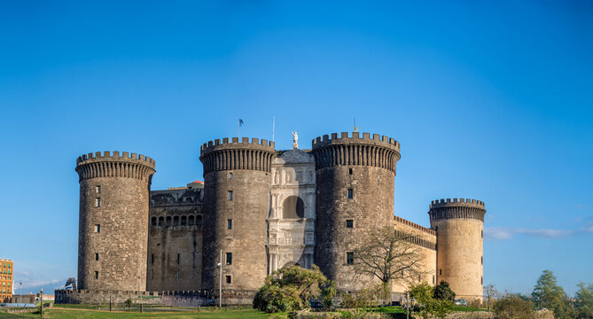 Naples, italy. December 27, 2024. Castel nuovo, also called maschio angioino, an iconic medieval castle and fortress, standing under a clear blue sky in naples