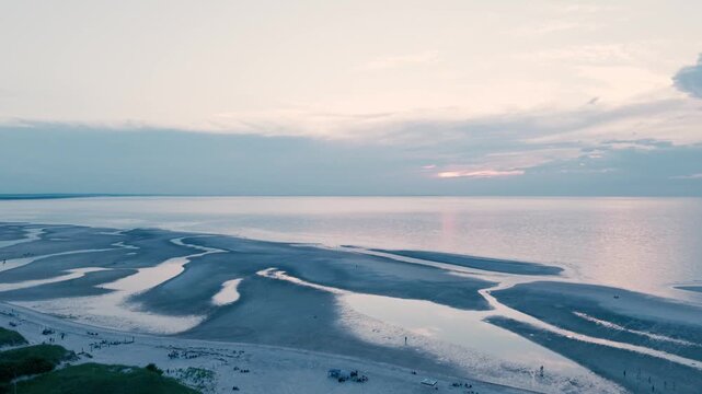 4K drone video of a calm ocean and beach at dusk. Mayflower Beach, Cape Cod, Massachusetts, MA, USA