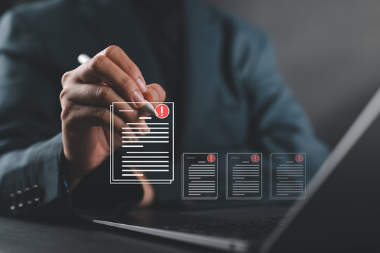 Businesswoman review procedures through documents containing checkbox lists,rules and policies concepts, company regulatory documents, terms and conditions,rules of conduct.