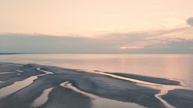 4K drone video of a calm ocean and beach at dusk. Mayflower Beach, Cape Cod, Massachusetts, MA, USA