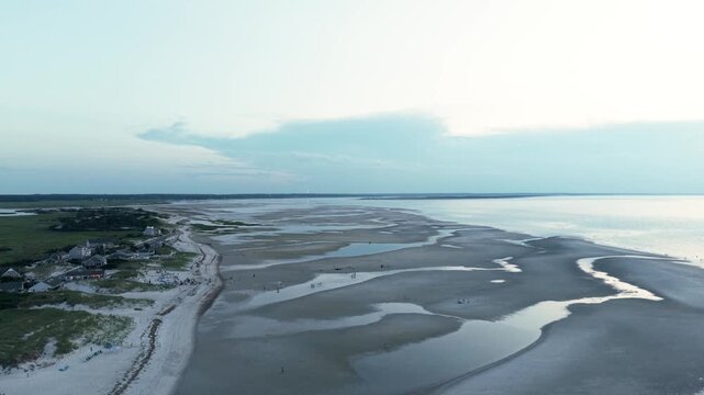 4K drone video of a calm ocean and beach at dusk. Mayflower Beach, Cape Cod, Massachusetts, MA, USA
