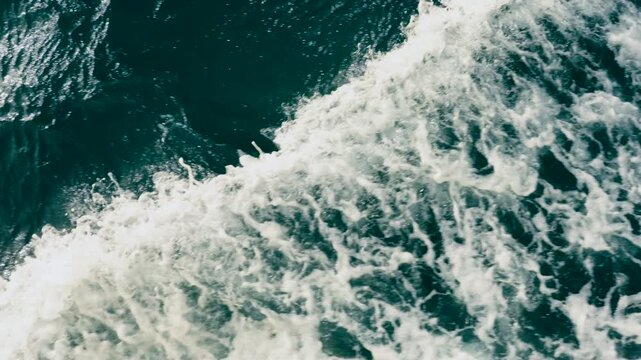 Epic sea water foam ocean waves texture background horizontal cruise ship boat wake.
