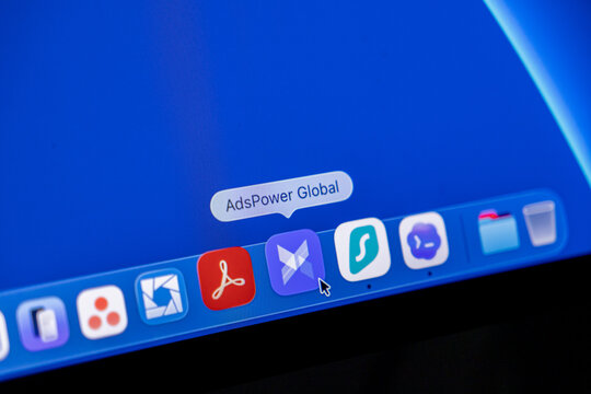 Poznan, Poland - February 23, 2026: AdsPower Global icon highlighted on a computer taskbar for managing multiple browser accounts with privacy software on a modern digital desktop