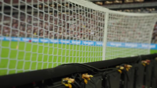 Penalty kick during a football match from behind the goal