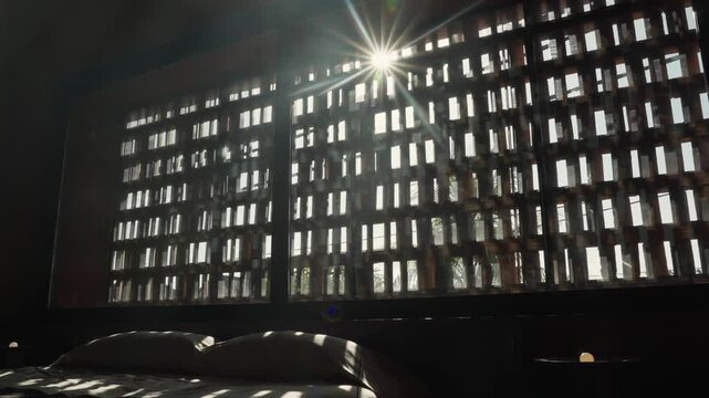 Sun shining through modern architectural window screen