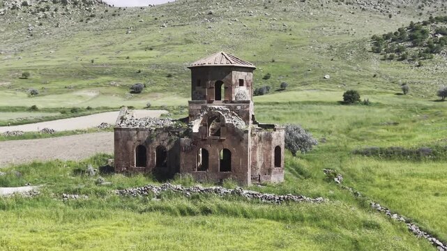 Drone Footage of Kizil Kilise in Guzelyurt Aksaray Turkey Showing Early Christian Red Stone Church and Anatolian Landscape