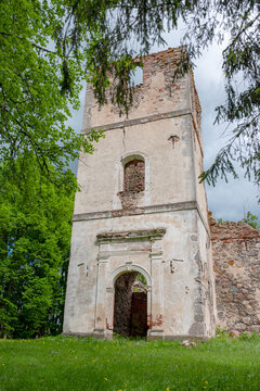 Sunny landscape with old stone church ruins, The church was a brick building with a rectangular chancel and a protruding tower with a baroque spire.