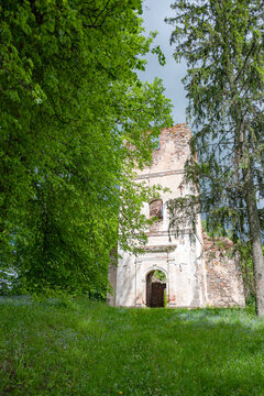 Sunny landscape with old stone church ruins, The church was a brick building with a rectangular chancel and a protruding tower with a baroque spire.
