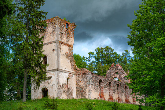Sunny landscape with old stone church ruins, The church was a brick building with a rectangular chancel and a protruding tower with a baroque spire.