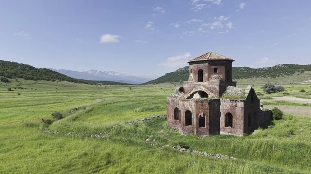 Drone Footage of Kizil Kilise in Guzelyurt Aksaray Turkey Showing Early Christian Red Stone Church and Anatolian Landscape