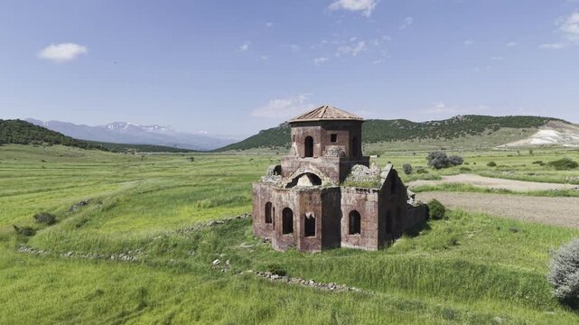 Drone Footage of Kizil Kilise in Guzelyurt Aksaray Turkey Showing Early Christian Red Stone Church and Anatolian Landscape