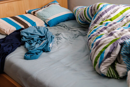 pillows on a messy bed