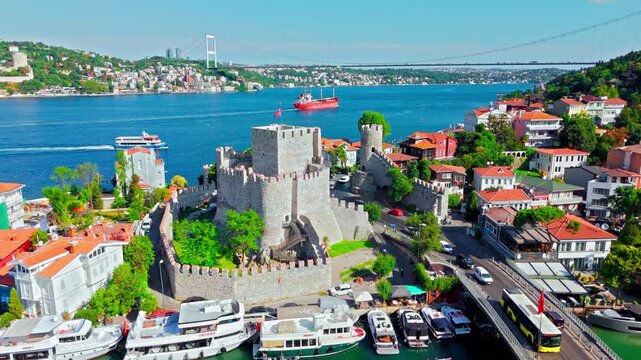 Aerial view of Anadoluhisarı, Istanbul, Turkey. Modern buildings, green trees and the Bosphorus coastline stretch across the Asian side district.