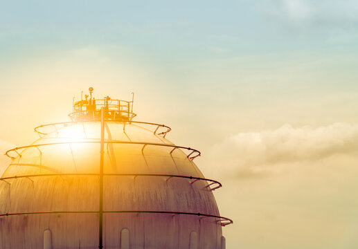 Industrial gas storage tank. LNG or liquefied natural gas storage tank. Spherical gas tank in petroleum refinery. Above-ground storage tank. Natural gas storage industry and global market consumption