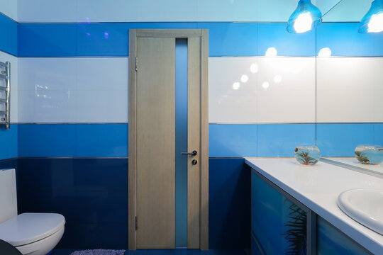 Wooden interior door in the bathroom