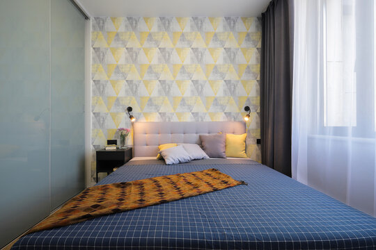Double bed in the bedroom interior