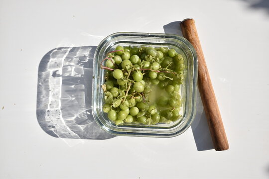 Crushing Unripe Green Grapes for Homemade Verjuice, Traditional Sour Grape Juice Preparation, Close Up