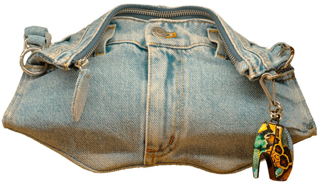 The Manta clutch by McQueen, in denim with a distressed finish, is made from recycled cotton. Milan, Italy, 8 July 2026