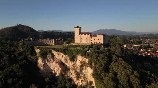 Sunlit Aerial View of Rocca di Angera Castle Over Historic Village