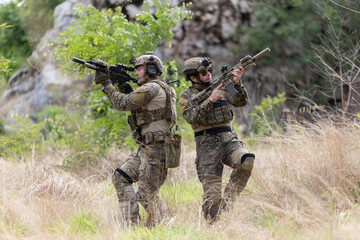 Fototapeta premium Military participate in a patrol in a rocky terrain