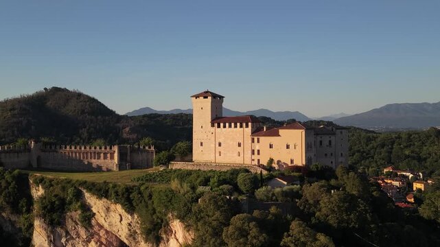 Sunlit Aerial View of Rocca di Angera Castle Over Historic Village