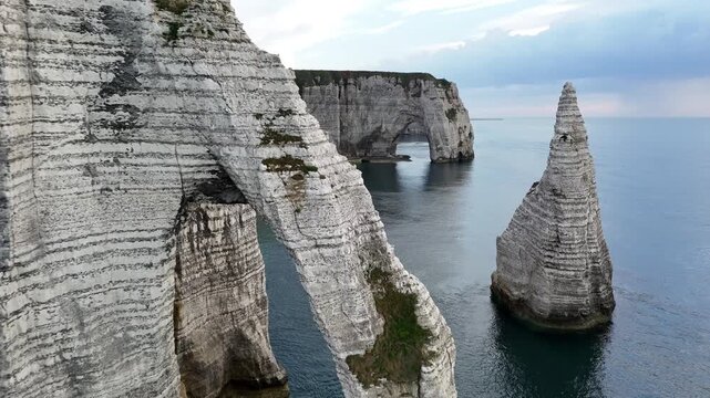 Drone view of Etretat France famous chalk cliffs and stunning rock arches