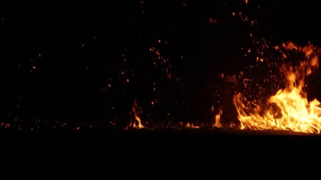 Flames burning in the dark background.
