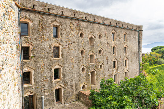 Interior view of the courtyard of the medieval fortress of Priamar in Savona, Liguria, Italy. Close-up of an ancient fortified courtyard with medieval walls.