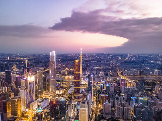 Obraz premium Guangzhou CBD Skyline at Dusk with Illuminated Towers and River