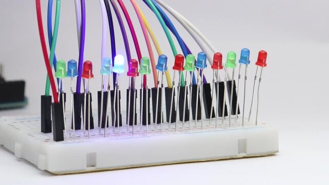 Multiple color LED or the light emitting diodes are arranged in breadboard and tested for working. Glowing LEDs of red, blue and green color